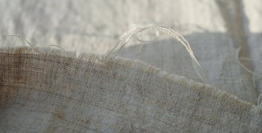 Threads of hemp fabric or hemp canvas. Sunlight. Sustainable lifestyle. Copy space.