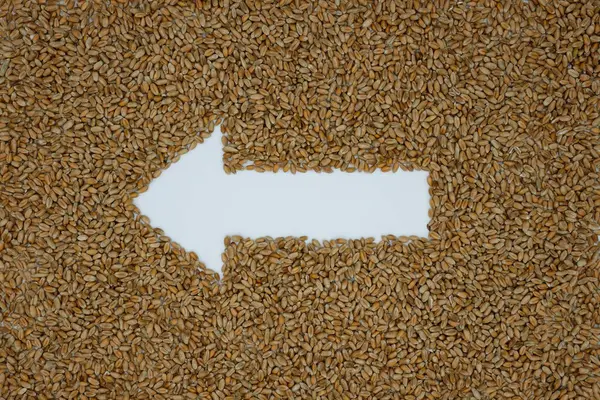 Wheat. Left Arrow. Grain background. Grain supply. Agricultural independence.