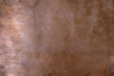 Bakır tasarım arka planı. Sol ışıklandırmalı bakır yüzey. Boşluğu kopyala.