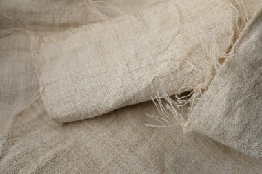 Yıpranmış kenevir bezi. Kenevir kumaşı ya da kenevir bezi. Sürdürülebilir ve çevre dostu tekstil.