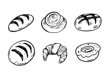 Çekici bir el yapımı fırın eşyaları koleksiyonu çeşitli lezzetli hamur işleri ve taze ekmekler sergiliyor.