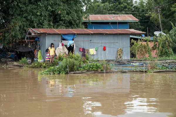 stock image Uthai Thani, Thailand - 5 Oct 2022, The flood has cut the village and a lot of home off from the outside world at Uthai Thani Province in October B.E. 2565.