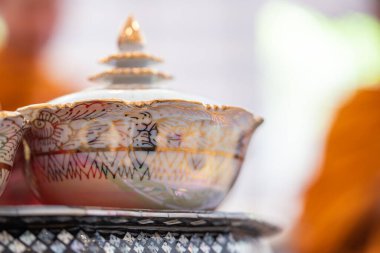 Thai bowl set arranged with rice, dishes on the small thai wooden table, symbolizing respect for Buddhist monks during morning ceremonies. clipart