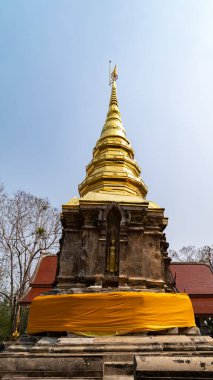 Wat Phra That Chom Kitti is its crooked chedi, contains a fragment of the Buddha relic that was split divided amongst this site, Chiang Rai, Thailand.
