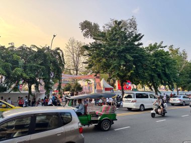 Bangkok, Thailand - 16 Nov 2024, People Gather Along the Roadside, Creating a Lively Atmosphere During the Golden Mountain Temple Festival at Wat Saket. clipart