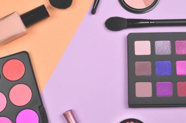 Professional makeup products with cosmetic beauty products, foundation, lipstick,  eye shadows, eye lashes, brushes and tools.
