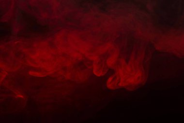 Siyah arka planda kırmızı buhar. Boşluğu kopyala.