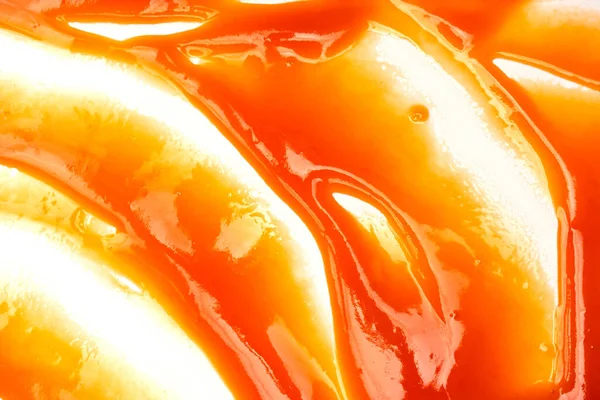 Tasty red sauce splashes as a background.