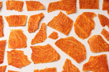 A group of tasty beer snacks. Dehydrated chicken meat slices. 