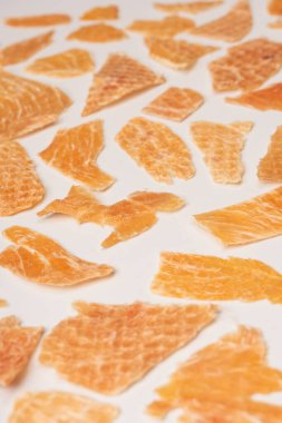 A group of tasty beer snacks. Dehydrated chicken meat slices. 