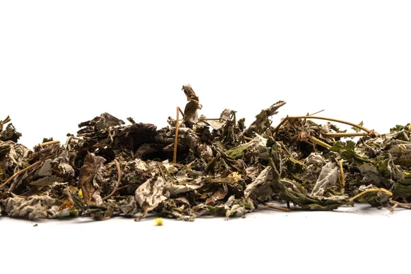 Dry tea leaves and dry fruit isolated on a white background.