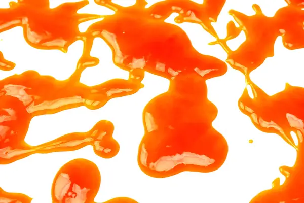 Gli Spruzzi Salsa Arancioni Isolati Bianco Uno Sfondo Vista Dall — Foto Stock