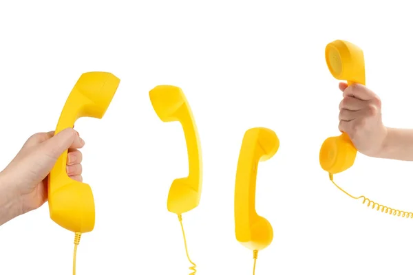 Κίτρινο Ακουστικό Στο Χέρι Γυναίκα Απομονώνονται Λευκό Αντιγραφή Χώρου — Φωτογραφία Αρχείου