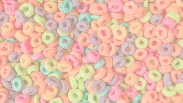 Sweet multicolored flakes, cereal loops as a background..