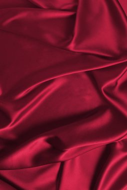 Viva magenta silk or satin luxury fabric texture can use as abstract background. Top view.