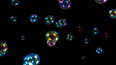 Sabun köpükleri siyah arkaplanda izole edilmiş.