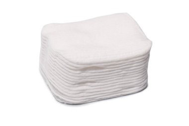 Stack of white cotton sponges isolated on a white background.