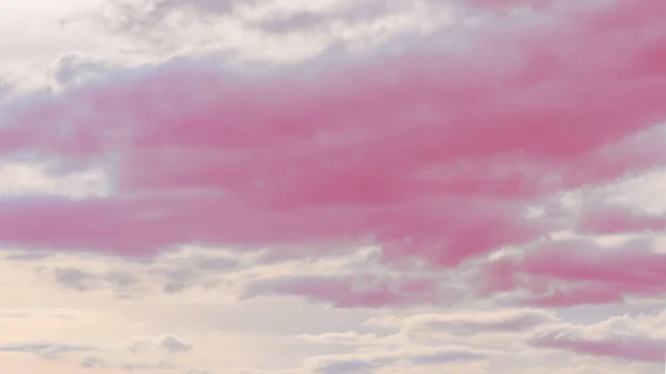 Pink Sky and clouds as a background. Beautiful sky background.