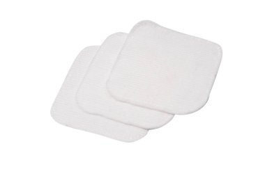 Stack of white cotton sponges isolated on a white background.
