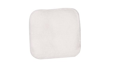 Stack of white cotton sponges isolated on a white background.