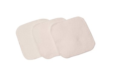 Stack of white cotton sponges isolated on a white background.