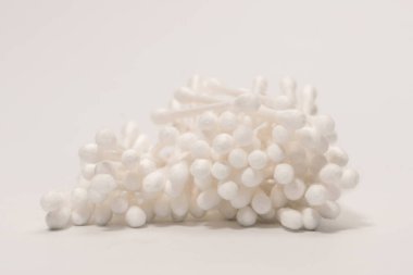 Group of white cotton buds isolated on a white background.
