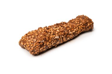 A loaf of bread with sunflower seeds isolated on a white background. 