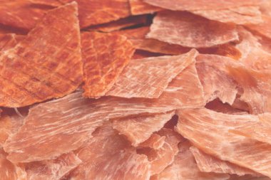 A group of tasty beer snacks. Dehydrated chicken meat slices. 