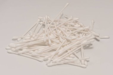 Group of white cotton buds isolated on a white background.