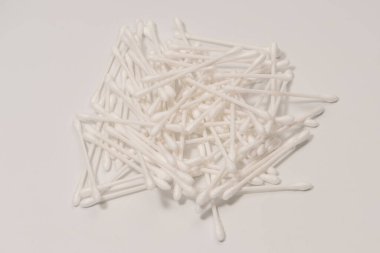 Group of white cotton buds isolated on a white background.