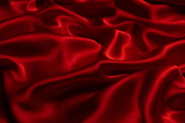 stock image Red silk or satin luxury fabric texture can use as abstract background. Top view.