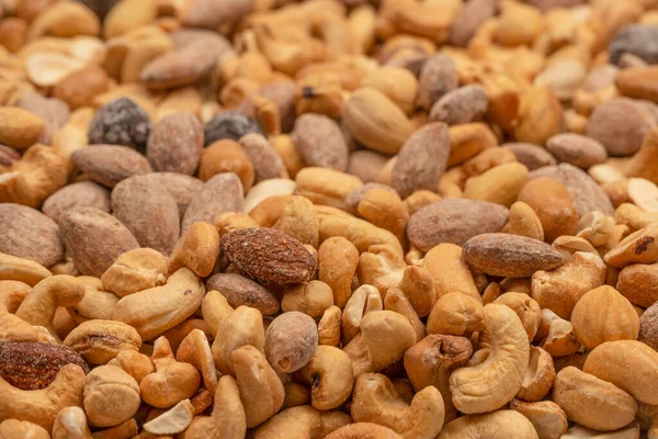 stock image Mix of tasty salty nuts.  A group of almonds, pistachios, walnuts, macadamia, cashews.