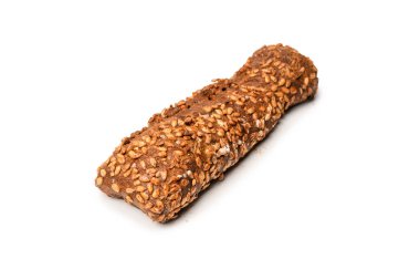 A loaf of bread with sunflower seeds isolated on a white background. 