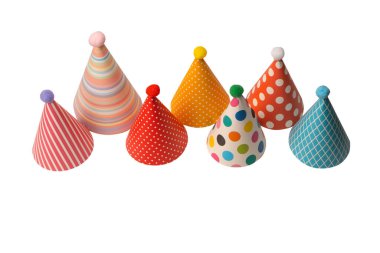 A group of bright and colorful birthday caps isolated on a white background. Holidays cocept. 