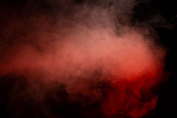 Orange and red steam on a black background. Copy space.