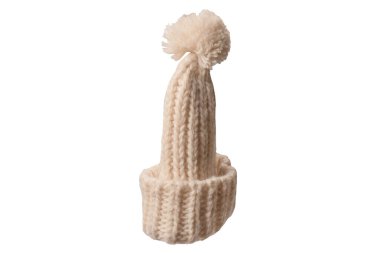 Beige warm beanie hat with pom pom isolated on a white background. 