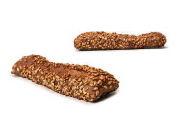 A loaf of bread with sunflower seeds isolated on a white background. 