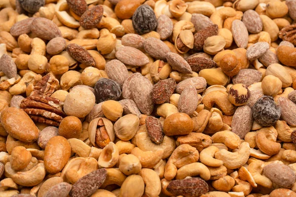 stock image Mix of tasty salty nuts.  A group of almonds, pistachios, walnuts, macadamia, cashews.