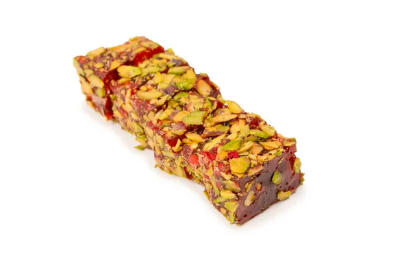 Sweet roll with pomegranate and pistachios, turkish sweets. Turkish rahat isolated on a  white background.