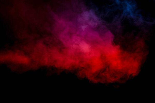 Purple and blue steam on a black background. Copy space.