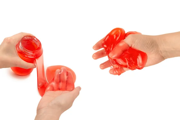 Beyaz Ellerle Izole Edilmiş Bir Kadının Elindeki Kırmızı Balçık Oyuncağı — Stok fotoğraf