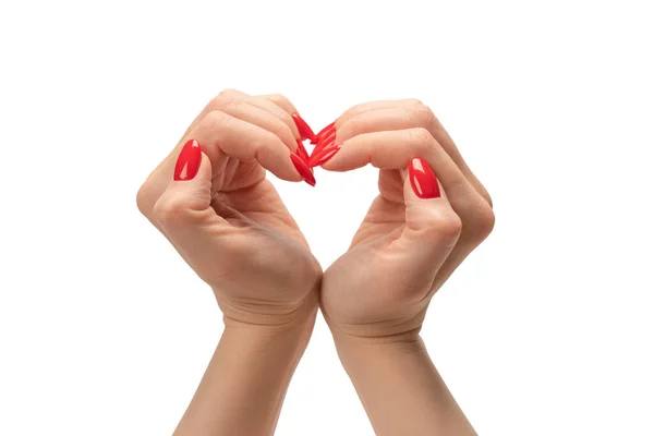 Крупный План Сердечного Символа Сделан Женскими Руками Красными Ногтями Изолированными — стоковое фото