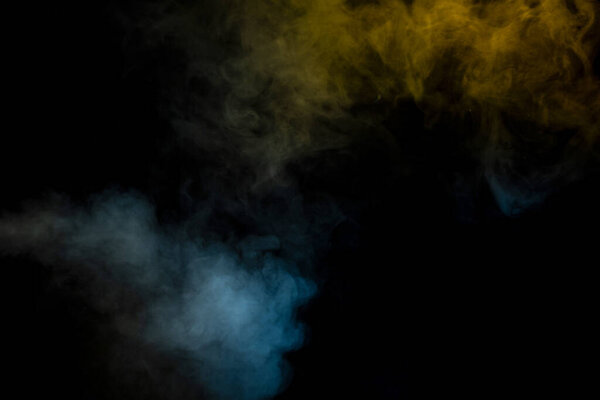Blue and yellow steam on a black background. Copy space.