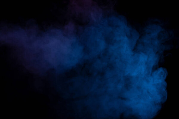 Blue and purple steam on a black background. Copy space.