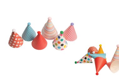 A group of bright and colorful birthday caps isolated on a white background. Holidays cocept. 