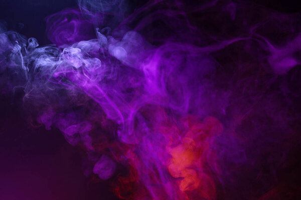 Violet and pink steam on a black background. Copy space.
