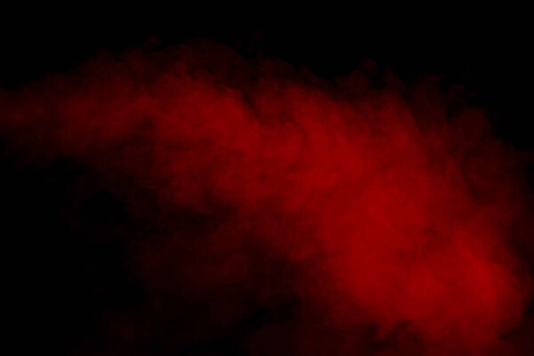 Orange and red steam on a black background. Copy space.