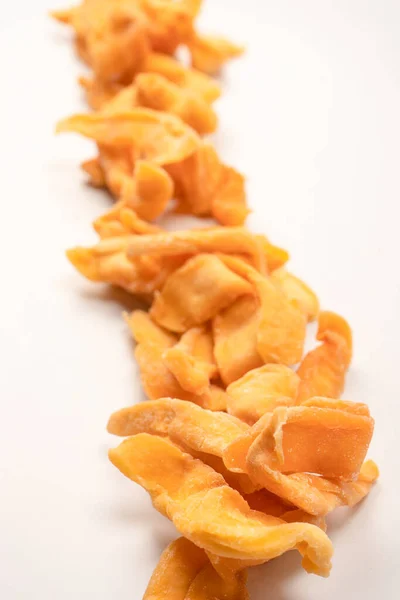 Dried melon slices isolated on a white background. Dried fruit.