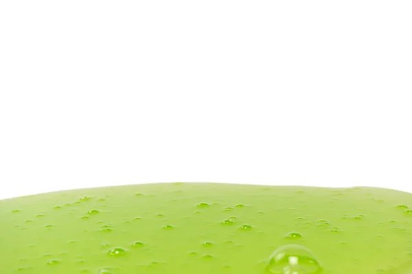 白い背景に隔離された緑色のスライムのおもちゃ トップビュー — ストック写真