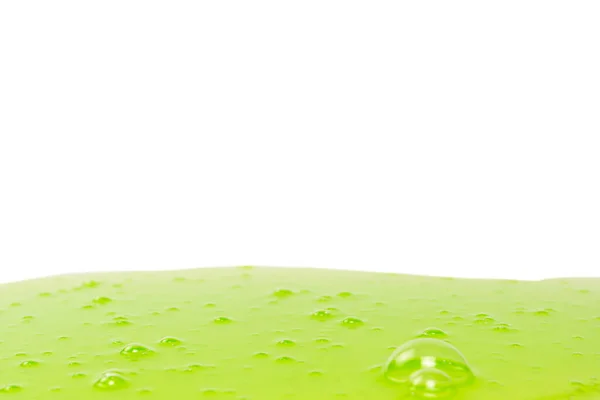 白い背景に隔離された緑色のスライムのおもちゃ トップビュー — ストック写真